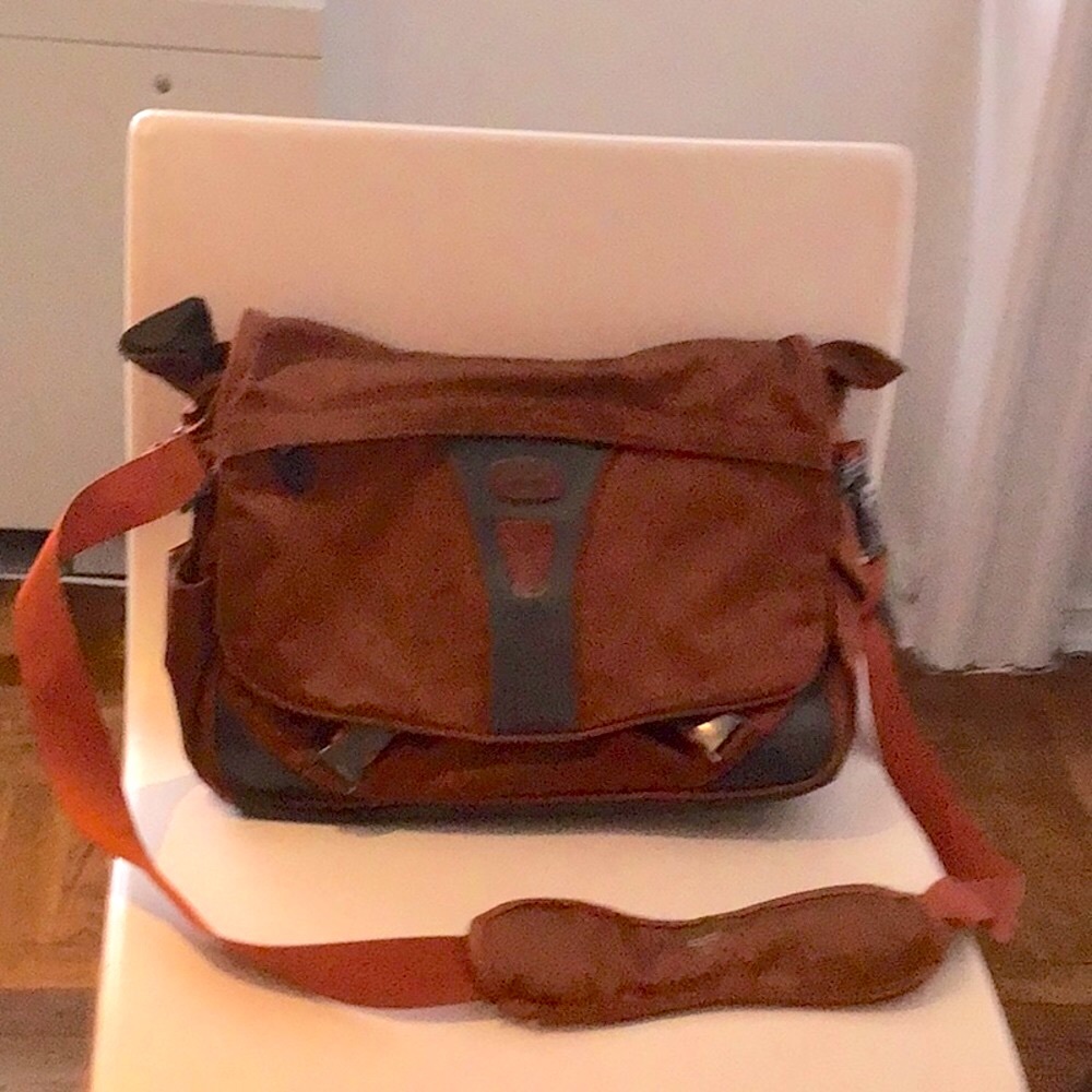 Tumi Laptop Briefcase. Many pockets.  Depth 10" (can go to 12").  Width 14".